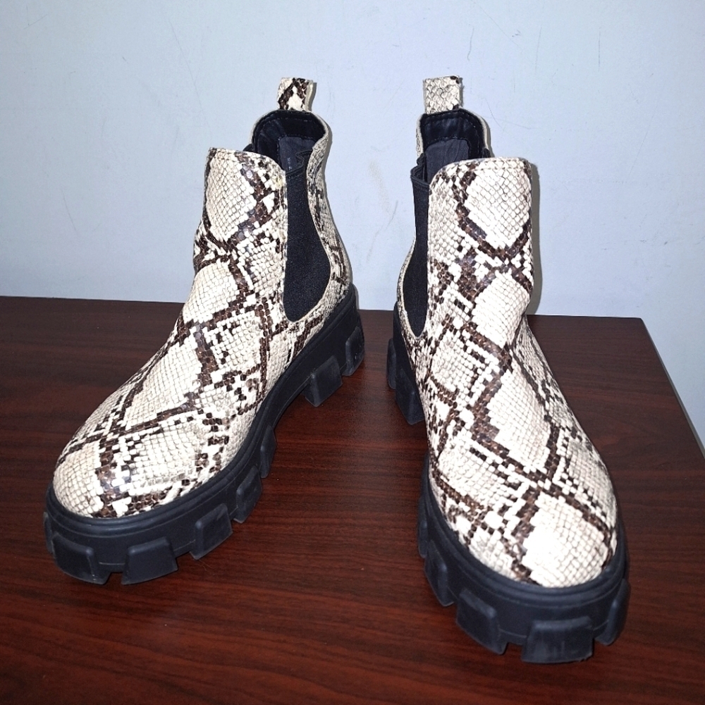 A pair of Circus NY snakeskin booties in a ladies size 9. Pre-loved great shape